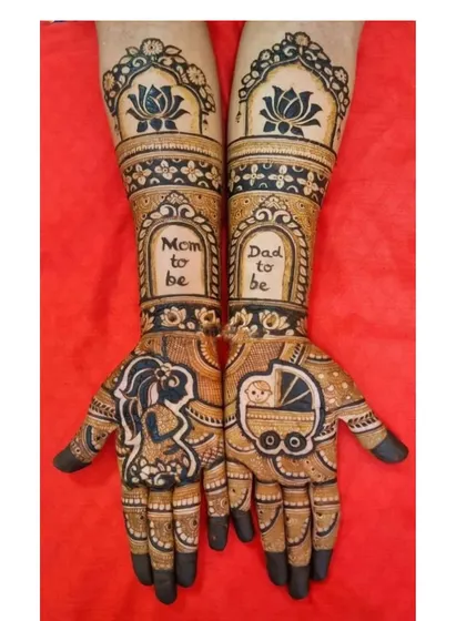 I love creating custom mehandi for baby showers. This design features a silhouette of an expecting mother, a baby in a pram, and the words "Mom to be" and "Dad to be" to celebrate the new journey.
