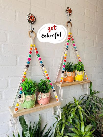 Our mini ceramic owl planters are so versatile. Here they are styled with our colorful beaded macrame shelves, creating a lively and charming wall display. Remember, you can get two of these planters for free when you buy two.
