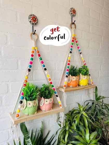 Our mini ceramic owl planters are so versatile. Here they are styled with our colorful beaded macrame shelves, creating a lively and charming wall display. Remember, you can get two of these planters for free when you buy two.