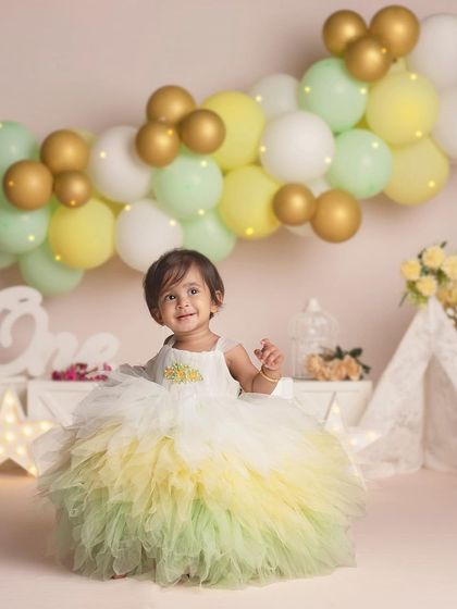 Another shot of this adorable birthday girl, looking radiant in her pastel-colored dress.