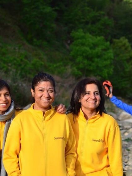 A candid moment of friendship and fun during an outdoor excursion.