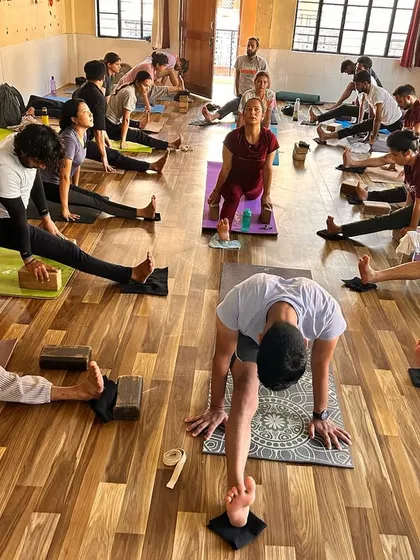 Another view of our hip-opening class. You can see students at different levels of flexibility, all working diligently with the help of props.
