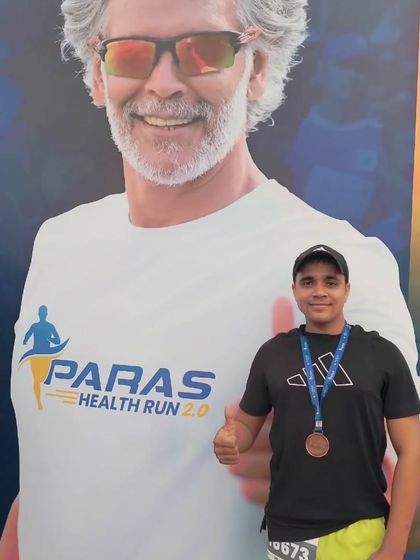 Posing next to a poster of Milind Soman, a fitness icon, at the Paras Health Run.