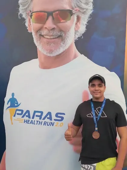 Posing next to a poster of Milind Soman, a fitness icon, at the Paras Health Run.