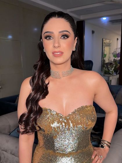 A detailed shot of the matte smokey eye. I used grey lenses to add a pop to her eyes, balancing the intensity with a soft, peachy-nude lip.