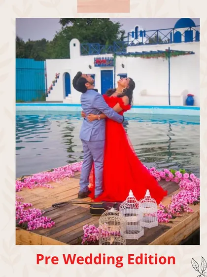 A fun and romantic pre-wedding moment captured on a decorated raft. The bride-to-be's red gown provides a beautiful pop of color against the water and the groom-to-be's light-colored suit.