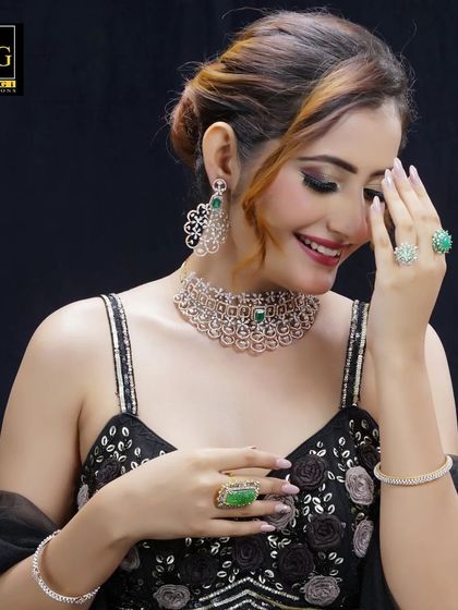 This is another look from the same jewelry campaign. The elegant updo is styled to showcase the model's profile, ensuring the intricate earrings and necklace are perfectly visible.