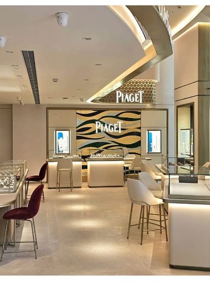 The Piaget corner at TimeVallée features a striking back wall with an artistic, wave-like pattern, reflecting the brand's creative spirit. The entire multi-brand showroom is designed to provide a seamless yet diverse journey through the world of luxury watchmaking.