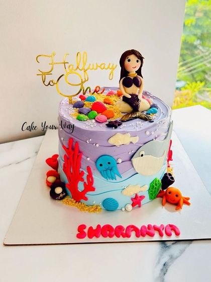 Mermaid dreams for a half birthday. A magical under-the-sea cake for being "Halfway to One."