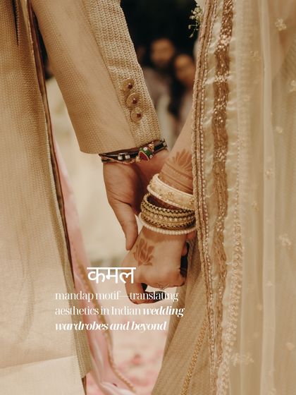 A close-up of the couple holding hands, the 'Kamal' or lotus motif subtly present in the bride's mehendi.