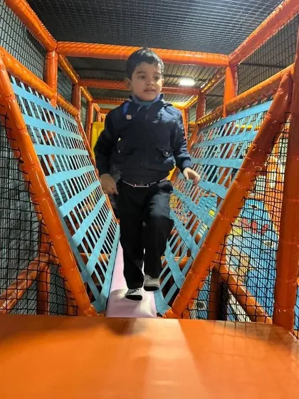 A student confidently navigates one of the netted bridges in our soft play zone. Safety is my top priority, with all structures designed to be secure and fully supervised for group visits.
