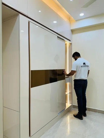 A close-up of the sliding wardrobe mechanism, showcasing the smooth operation and high-quality finish.