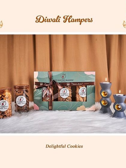 Our delightful cookies are a wonderful addition to any Diwali celebration. This gift set includes jars of our crunchy, flavorful cookies alongside a smaller assorted cookie box, paired with decorative candles.