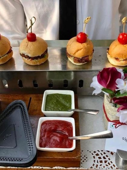 Mini veg sliders being served at a farm-themed birthday party. These bite-sized treats are perfect for kids and adults alike and are always a hit at my live stations.