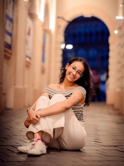A seated portrait from the same alleyway shoot. Getting low to the ground provides a unique perspective and makes the subject the hero of the shot.