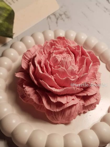 A new addition, our Peony aroma diffuser, styled on a white bubble tray. The contrast between the detailed flower and the simple, modern tray is something we love.