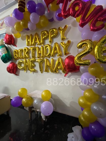 A detailed shot of the personalized foil balloon lettering. Adding a name and age makes the birthday surprise feel much more personal and special.