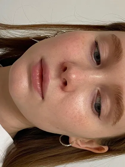 A close-up of beautifully laminated and shaped eyebrows. This is the kind of flawless, natural-looking result we teach our students to achieve.