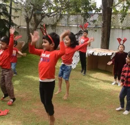 A collection of joyous moments from our Christmas party, including dancing, enjoying cupcakes, building a sand snowman, and posing for group photos.