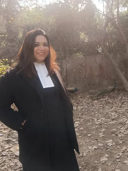 A day at work in my advocate's gown. Even in a quiet moment, the work of justice continues. The peacocks in the background are a beautiful reminder of the grace and integrity we must uphold.