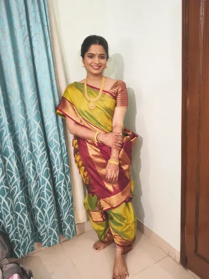 It was an honor to drape this traditional Madisar saree for Abhirami. I paired the nine-yard drape with a simple, natural makeup look that enhanced her features without being overpowering, keeping the focus on the elegance of the attire.