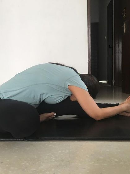 Janushirasana (Head-to-Knee Forward Bend). This pose is excellent for strengthening the back, reducing belly fat, and improving the function of the liver and kidneys.