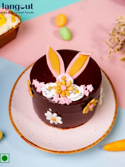 Hop into the sweetest season with our Dutch Truffle Easter Bunny Bento Cake. Rich chocolate ganache is topped with pastel swirls and bunny ears for the cutest bite of spring.
