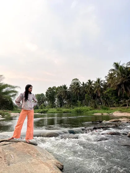 A thoughtful pose by the river's edge. The constant flow of water is a great metaphor for the creative process.