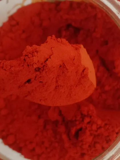A close-up look at the rich, vibrant texture of our handcrafted plant sindoor. This deep red kumkum powder is achieved without any artificial dyes, showcasing the pure pigment derived directly from the Sindoori plant seeds.