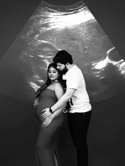 A truly unique concept where we project the baby's ultrasound scan onto the background, creating a powerful first family portrait.