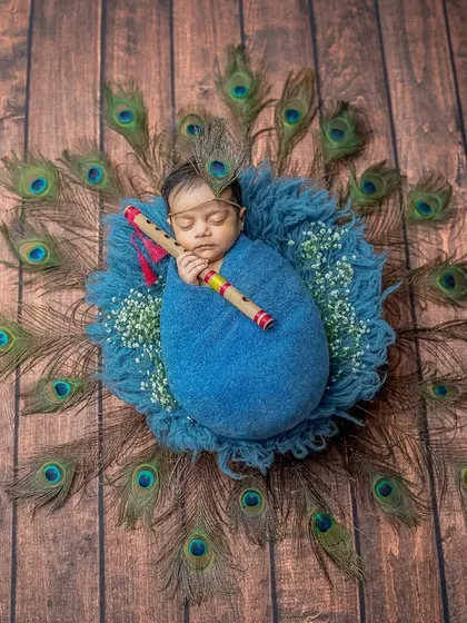 The combination of the rustic wood background and the vibrant blue and green colors makes for a visually rich and textured photograph.