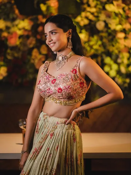 This shot shows the beautiful details of her hair and makeup. The look is romantic and bohemian.