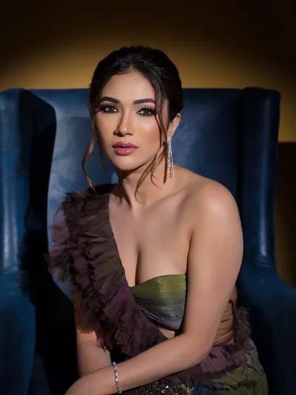 Actress Ridhima Pandit in a beautiful dual-toned gown by Anjum Qureshi. The ruffled one-shoulder detail adds a touch of modern romance to this elegant look.