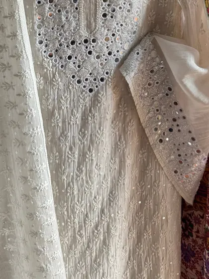 A detail shot of the sleeve, showing the mirrorwork on the cuff.