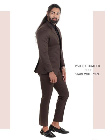 A side profile of the brown suit, highlighting its sharp silhouette and classic design.