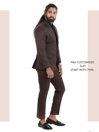 A side view of the brown suit, showing its clean, tailored lines.