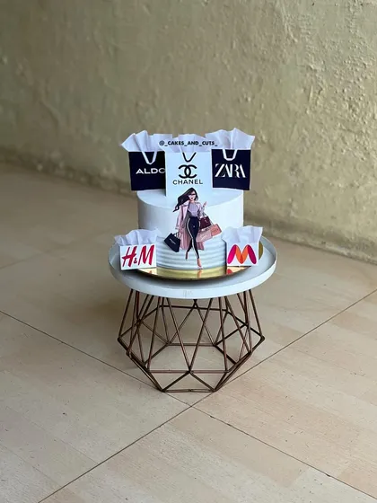 For the woman who loves to shop. This cake is decorated with edible images of shopping bags from popular brands like Zara, Chanel, and H&M.