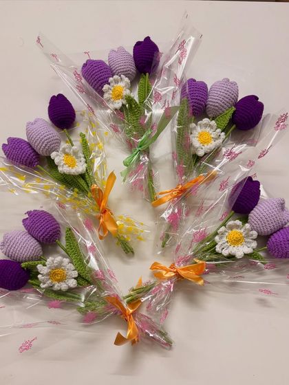 I also make these lovely tulip and daisy bouquets, which are perfect for return gifts or party favors. Here they are, ready to be gifted, in shades of purple and white.