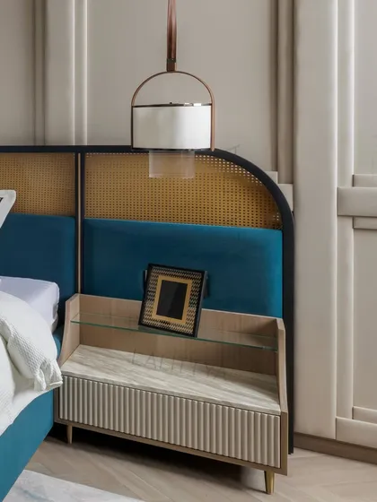 Detail of the bespoke bedside table, which features a fluted base, a marble shelf, and an integrated design that flows from the headboard. It’s a perfect example of our thoughtful, custom furniture.