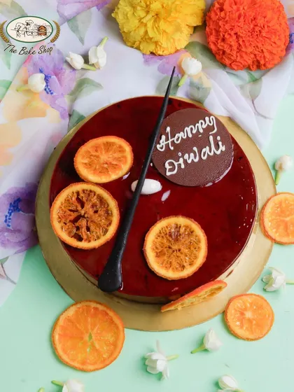 A festive Dark Chocolate Orange Cake for Diwali, decorated with candied orange slices for a zesty and rich flavor combination.