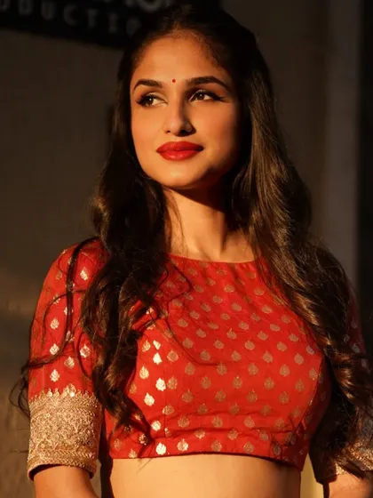 A golden hour shot of Kashish Kapoor. I used warm, glowing makeup with a classic red lip to catch the beautiful sunlight, creating a timeless and radiant look.
