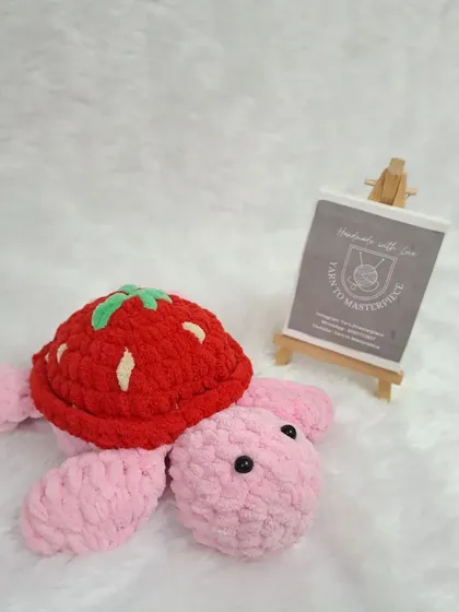 A single plush strawberry turtle.