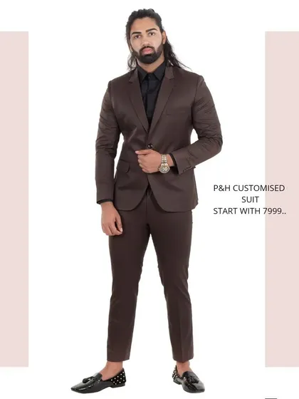 This classic two-piece suit in a rich brown color offers a warm and sophisticated alternative to black or navy.