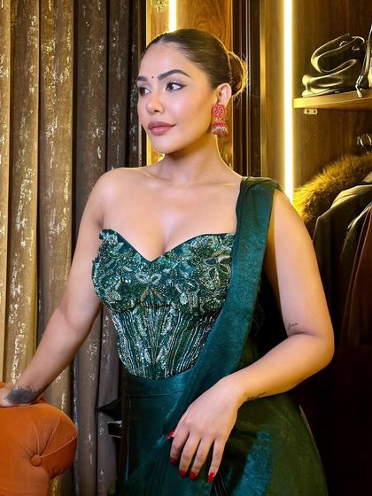 Another angle of this sophisticated festive look. The sleek hair and glowing skin create a very modern and chic aesthetic.