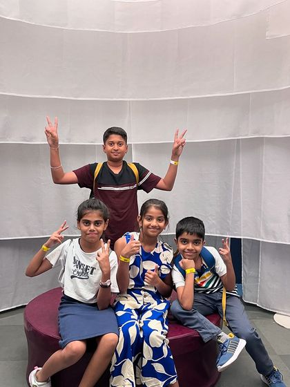 Happy faces and peace signs from our younger students during a fun outing. We believe in creating joyful memories together.