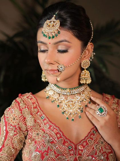 The delicate details make the look. This close-up highlights the soft glitter on the eyes and the flawless skin finish, perfectly complementing the intricate nose ring and jewellery.
