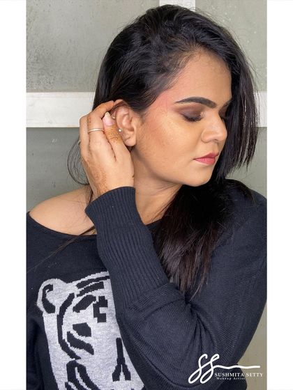 This pose shows off the soft glam of the brown smokey eye. It’s a versatile party makeup look that enhances your features without feeling too heavy.