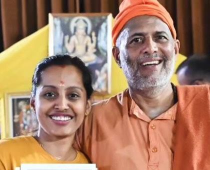 Sharing a smile with a student. The bonds formed at the ashram are built on a shared commitment to spiritual growth.