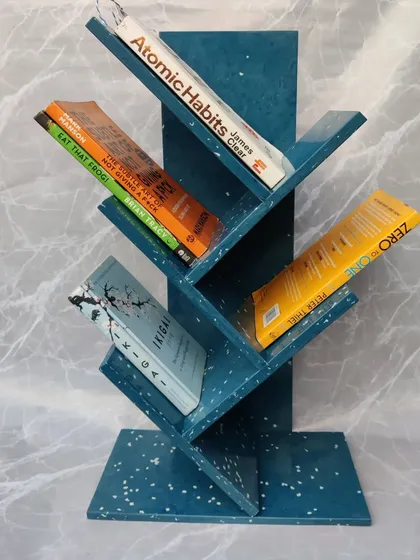 Our blue recycled plastic bookshelf filled with books. It's designed to be as strong and functional as it is beautiful, proving that sustainable choices don't require compromise.