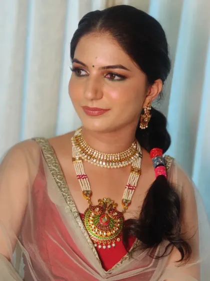 A different angle of Bhawna's Mehendi look, showcasing the colorful lace adorned hair that added a unique and fun element to her style.